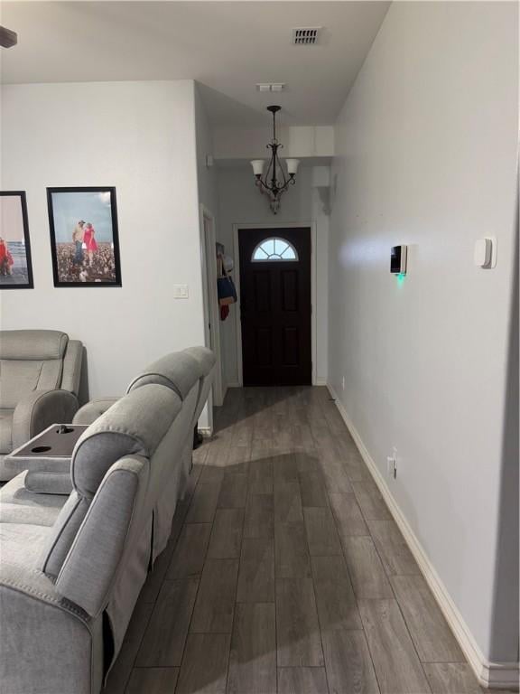 entrance foyer featuring an inviting chandelier