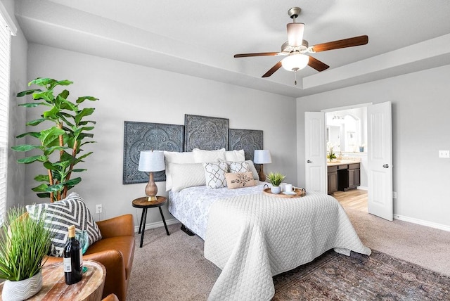 2530 Las Estrellas St, Corpus Christi, TX 78414 - bedroom featuring light colored carpet, ensuite bathroom, a tray ceiling, and ceiling fan