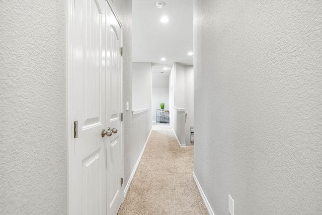 2530 Las Estrellas St, Corpus Christi, TX 78414 - hallway featuring a textured wall, carpet flooring, and recessed lighting
