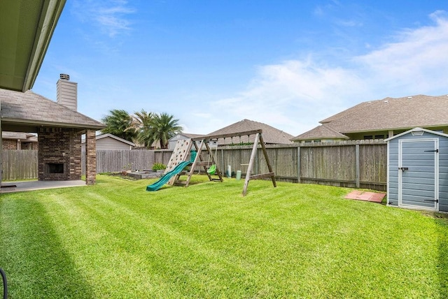 2530 Las Estrellas St, Corpus Christi, TX 78414 - fenced backyard with a playground, a brick fireplace, and a storage shed