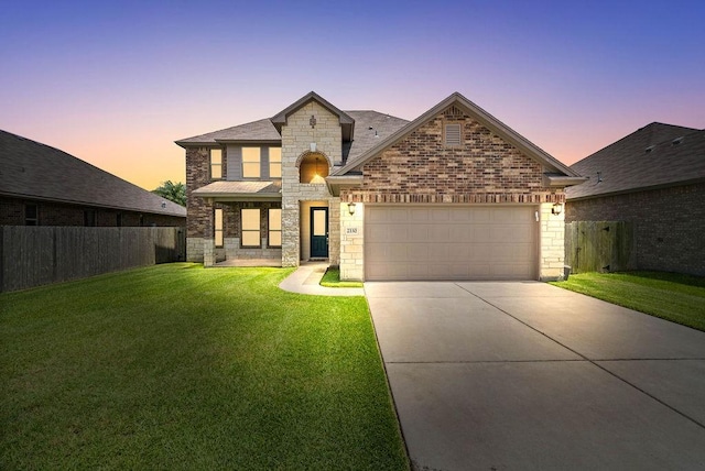 2530 Las Estrellas St, Corpus Christi, TX 78414 - view of front of property with stone siding, driveway, a garage, and brick siding