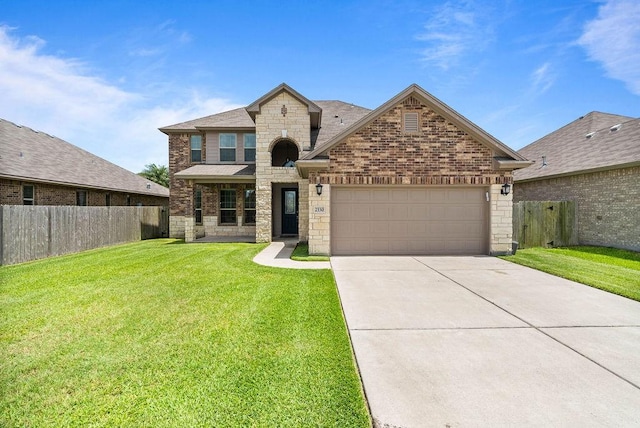 2530 Las Estrellas St, Corpus Christi, TX 78414 - view of front of house with stone siding, brick siding, concrete driveway, and a garage