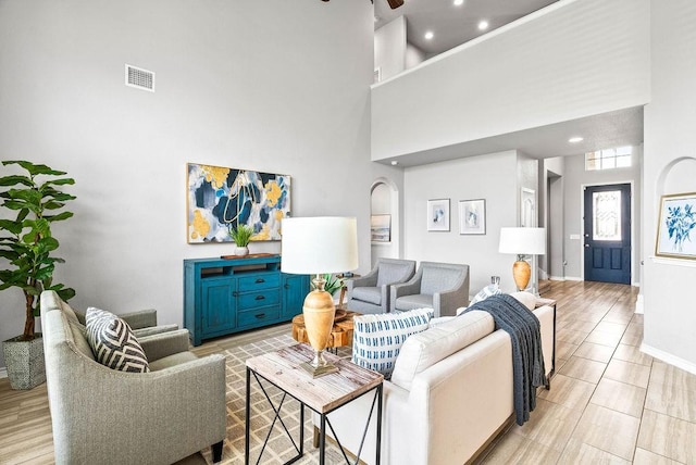2530 Las Estrellas St, Corpus Christi, TX 78414 - living room featuring a towering ceiling, arched walkways, recessed lighting, and a ceiling fan