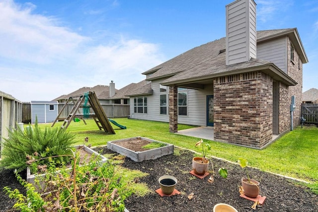 2530 Las Estrellas St, Corpus Christi, TX 78414 - rear view of property with a playground, a chimney, a fenced backyard, brick siding, and a patio area