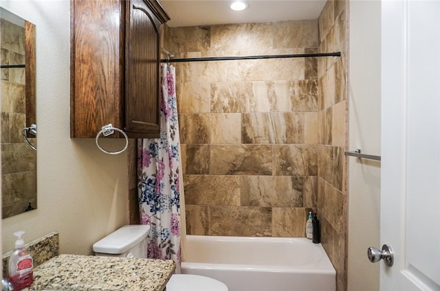 full bathroom featuring vanity, toilet, and shower / bath combination with curtain