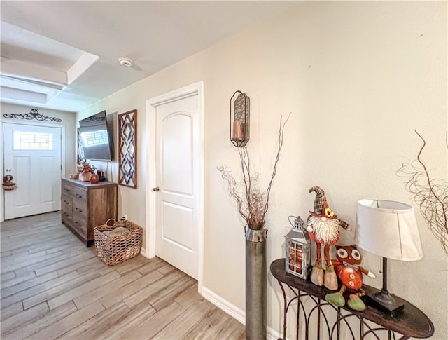 corridor with light hardwood / wood-style flooring