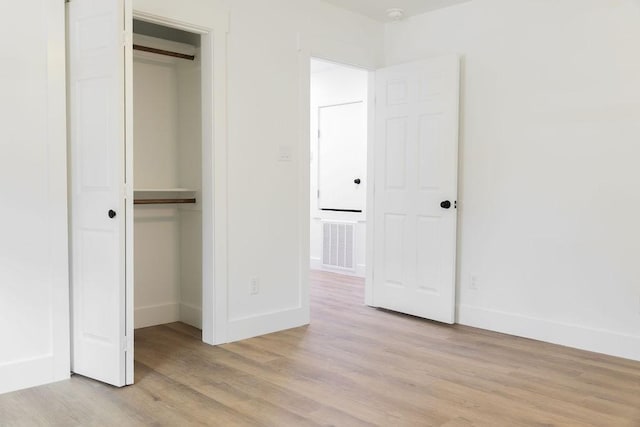 1101 Lillian St, Alice, TX 78332 - unfurnished bedroom featuring a closet and light wood-type flooring