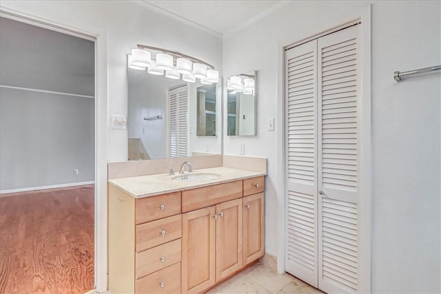 bathroom with vanity and crown molding