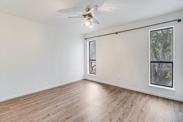 unfurnished room featuring ceiling fan and light hardwood / wood-style floors