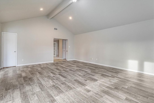 unfurnished room featuring high vaulted ceiling, beamed ceiling, and light hardwood / wood-style flooring