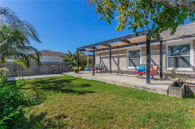 view of yard with a pergola and a patio