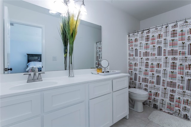 bathroom with tile patterned floors, vanity, curtained shower, and toilet