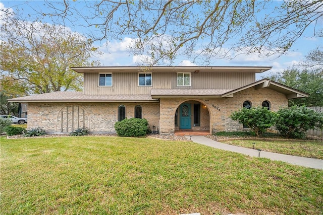 5049 Moultrie Dr, Corpus Christi, TX 78413 - traditional-style home with a front yard and brick siding