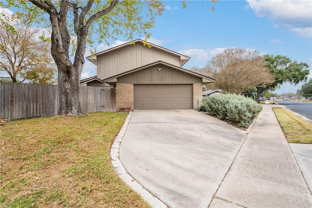 5049 Moultrie Dr, Corpus Christi, TX 78413 - view of front facade featuring brick siding, driveway, and a garage