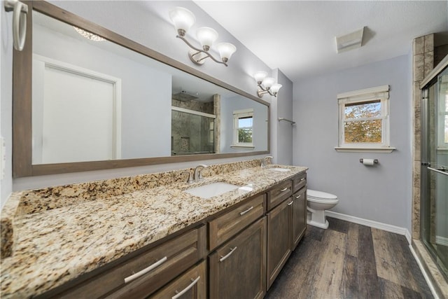 5049 Moultrie Dr, Corpus Christi, TX 78413 - bathroom featuring wood finished floors, baseboards, a shower stall, and healthy amount of natural light