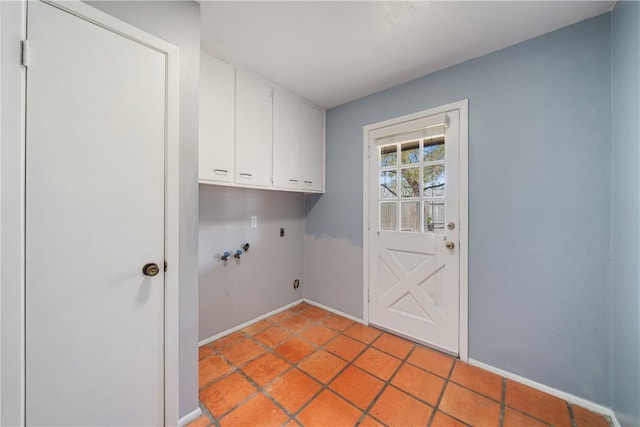 5049 Moultrie Dr, Corpus Christi, TX 78413 - laundry room featuring cabinet space, electric dryer hookup, washer hookup, baseboards, and light tile patterned floors