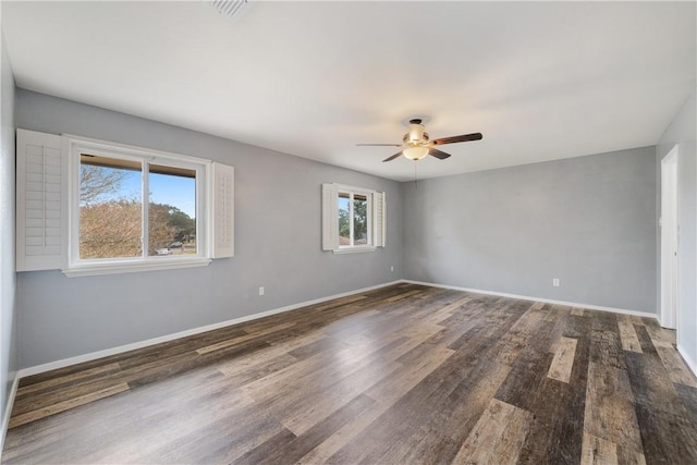 5049 Moultrie Dr, Corpus Christi, TX 78413 - empty room with ceiling fan, dark wood-style flooring, and baseboards