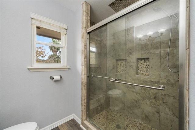 5049 Moultrie Dr, Corpus Christi, TX 78413 - full bath with toilet, baseboards, a shower stall, and wood finished floors