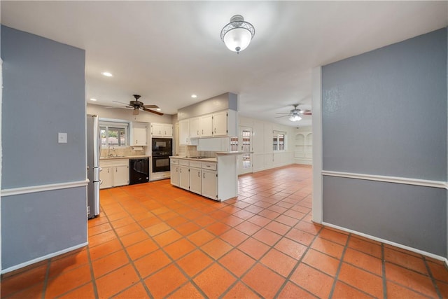 5049 Moultrie Dr, Corpus Christi, TX 78413 - kitchen with black appliances, a ceiling fan, tile patterned flooring, white cabinetry, and recessed lighting