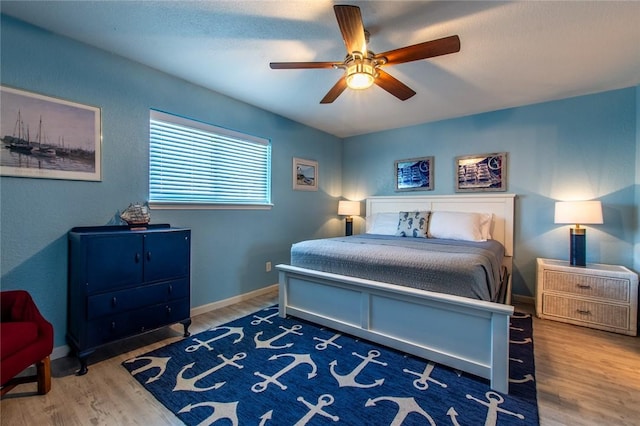 bedroom featuring ceiling fan and wood-type flooring