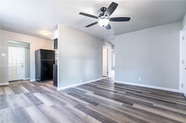 interior space with dark hardwood / wood-style floors and ceiling fan