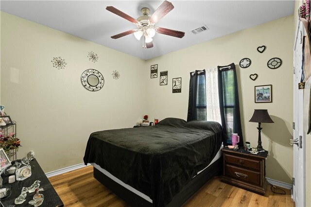 105 E Elm St, Taft, TX 78390 - bedroom featuring wood finished floors and ceiling fan