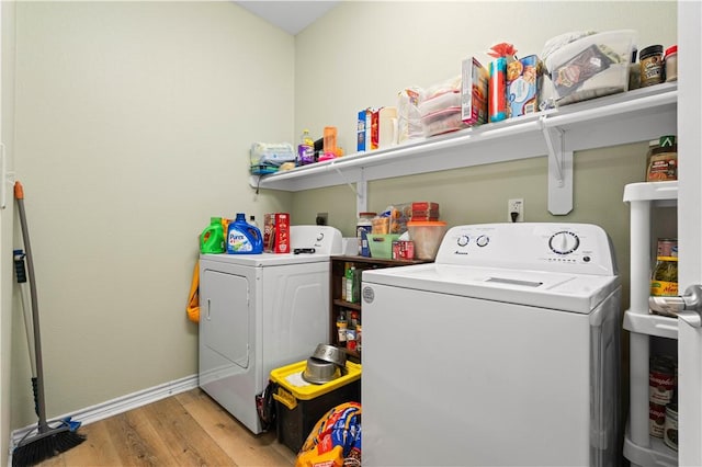 105 E Elm St, Taft, TX 78390 - laundry area featuring washing machine and dryer and light wood finished floors