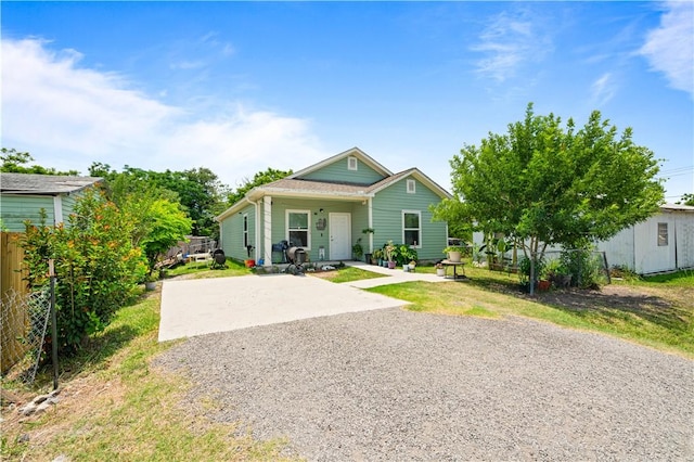 105 E Elm St, Taft, TX 78390 - view of front of house with driveway and covered porch