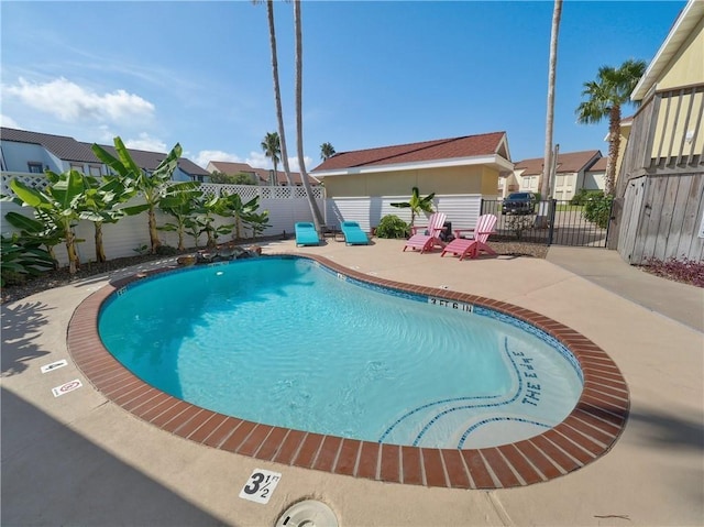 view of pool with a patio area, a fenced backyard, and a fenced in pool