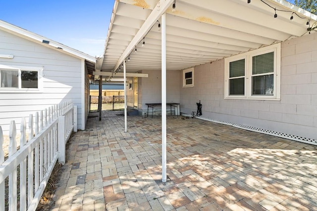 view of patio featuring fence