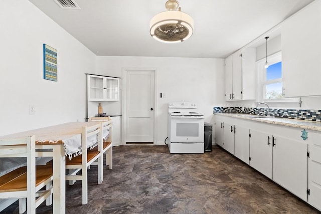 kitchen featuring white electric range oven, light countertops, visible vents, white cabinetry, and a sink