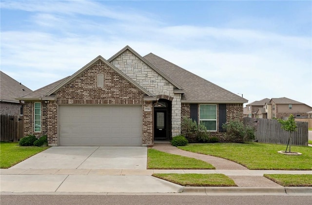 view of front of house featuring a garage, fence, concrete driveway, and a front lawn
