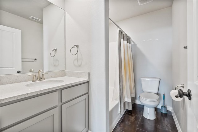 full bath featuring visible vents, shower / bath combo, vanity, baseboards, and toilet