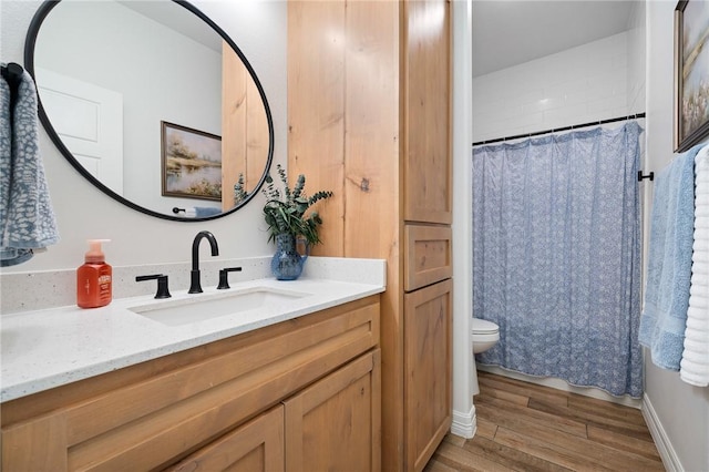 133 Longhorn Dr, Odem, TX 78370 - full bathroom with wood finished floors, vanity, and curtained shower