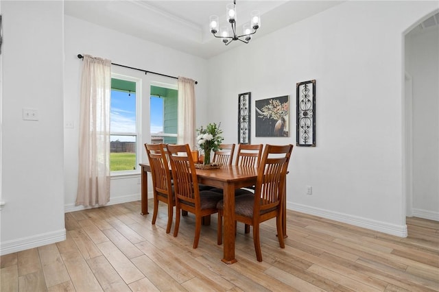133 Longhorn Dr, Odem, TX 78370 - dining room with a chandelier, light wood-style flooring, and arched walkways