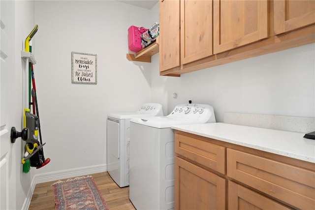 133 Longhorn Dr, Odem, TX 78370 - washroom with cabinet space, washing machine and dryer, and light wood-style flooring
