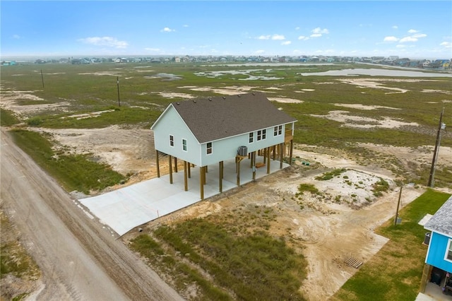 birds eye view of property featuring a rural view