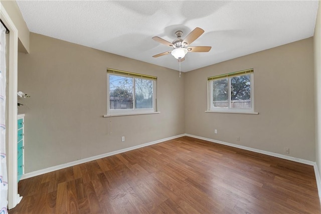 unfurnished room featuring ceiling fan, a textured ceiling, and hardwood / wood-style flooring