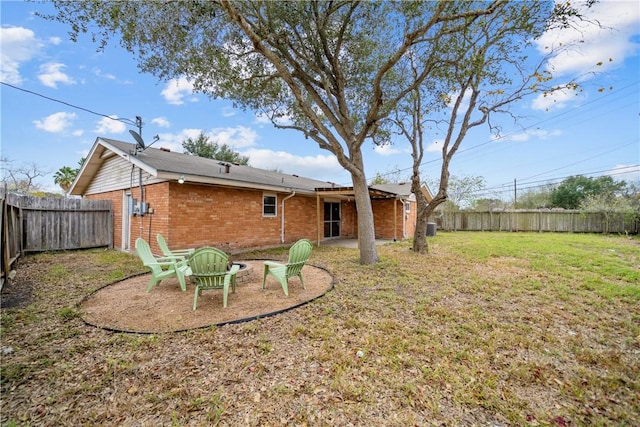 rear view of property with a lawn