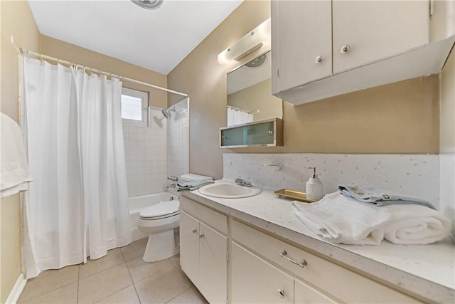 full bathroom featuring toilet, vanity, shower / tub combo with curtain, and tile patterned floors