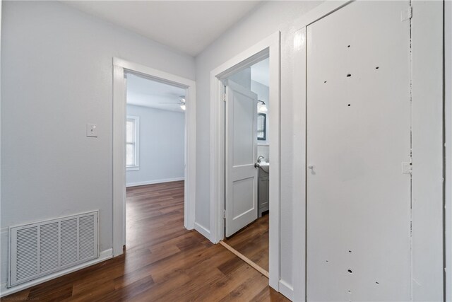 hallway featuring dark hardwood / wood-style floors