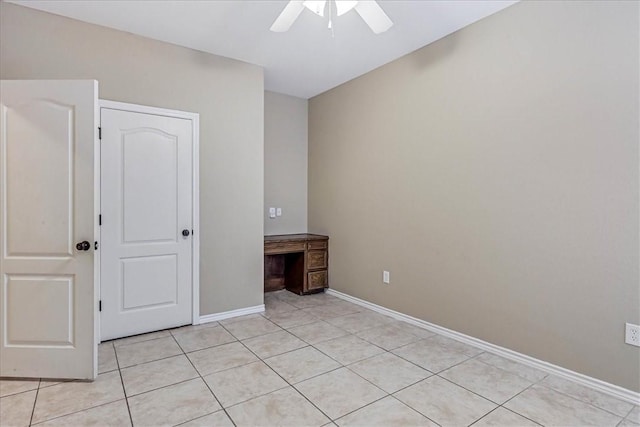 unfurnished bedroom with ceiling fan and light tile patterned flooring