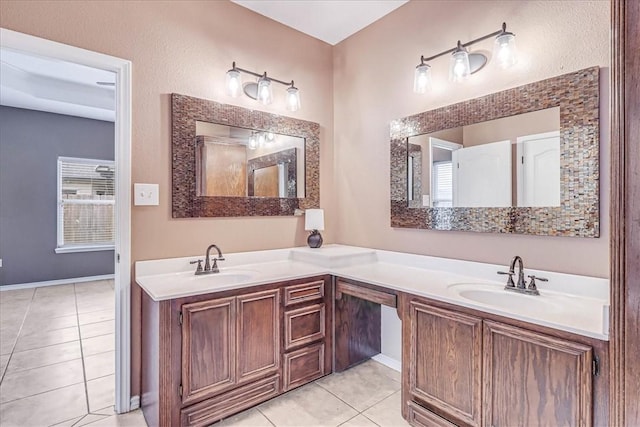 bathroom with tile patterned flooring and vanity