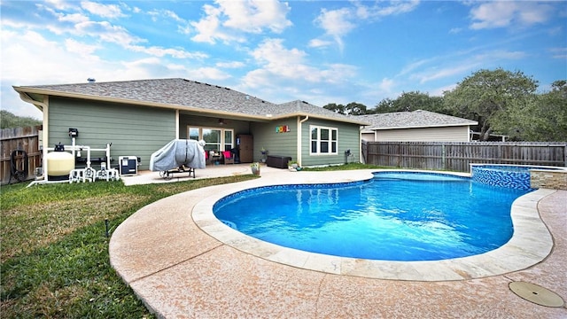 view of pool with a yard and a patio area