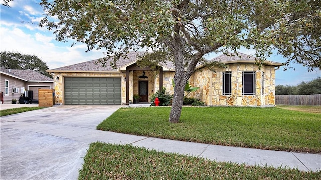 view of front facade featuring a front lawn and a garage