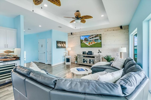 694 Kara Dr, Port Aransas, TX 78373 - living area with a ceiling fan, light wood-style flooring, recessed lighting, and a raised ceiling