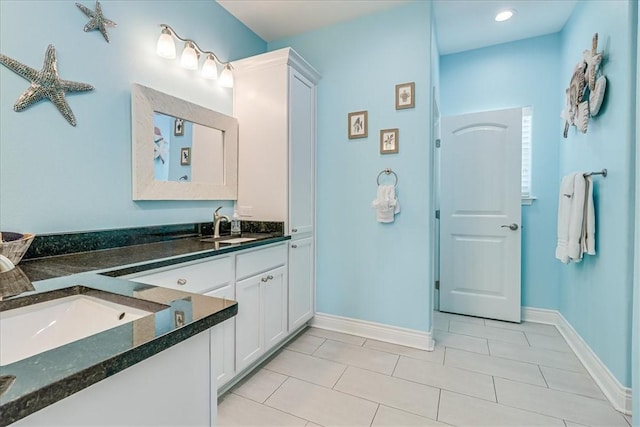 694 Kara Dr, Port Aransas, TX 78373 - bathroom with tile patterned flooring, vanity, and baseboards