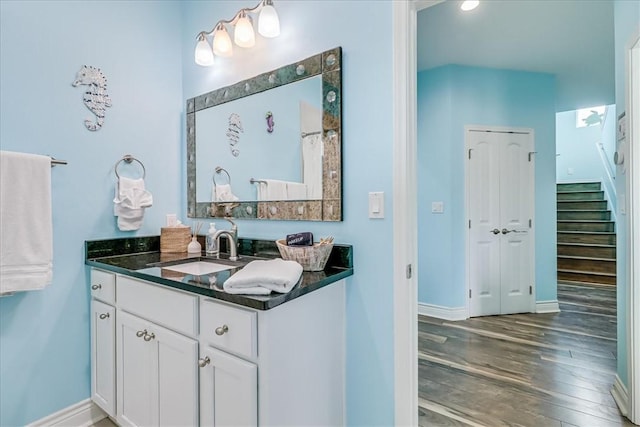 694 Kara Dr, Port Aransas, TX 78373 - bathroom with vanity, wood finished floors, and baseboards
