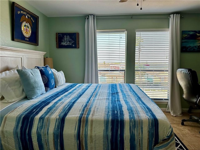 bedroom with multiple windows and ceiling fan