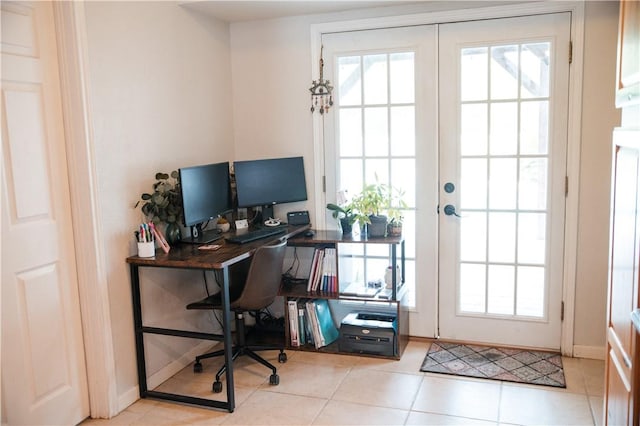 tiled home office with french doors, baseboards, and a healthy amount of sunlight